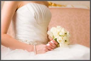 a bride holding a flowers.