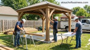 Construction crew building a custom wooden gazebo in a residential backyard. Workers cutting lumber and assembling structure.