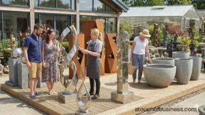 Staff helps customers choose modern steel garden sculptures and minimalist planters at a contemporary ornament store.