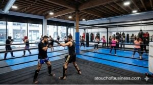 A Kickboxing gym with a sparring session and group class.