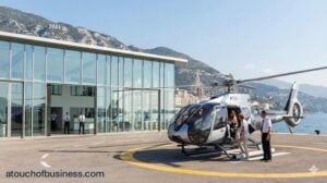 Passengers boarding a modern helicopter at a luxury seaside terminal for a professional tour business operation.