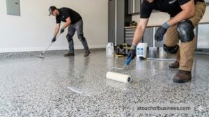 A team installs a decorative flake epoxy floor in a residential garage.