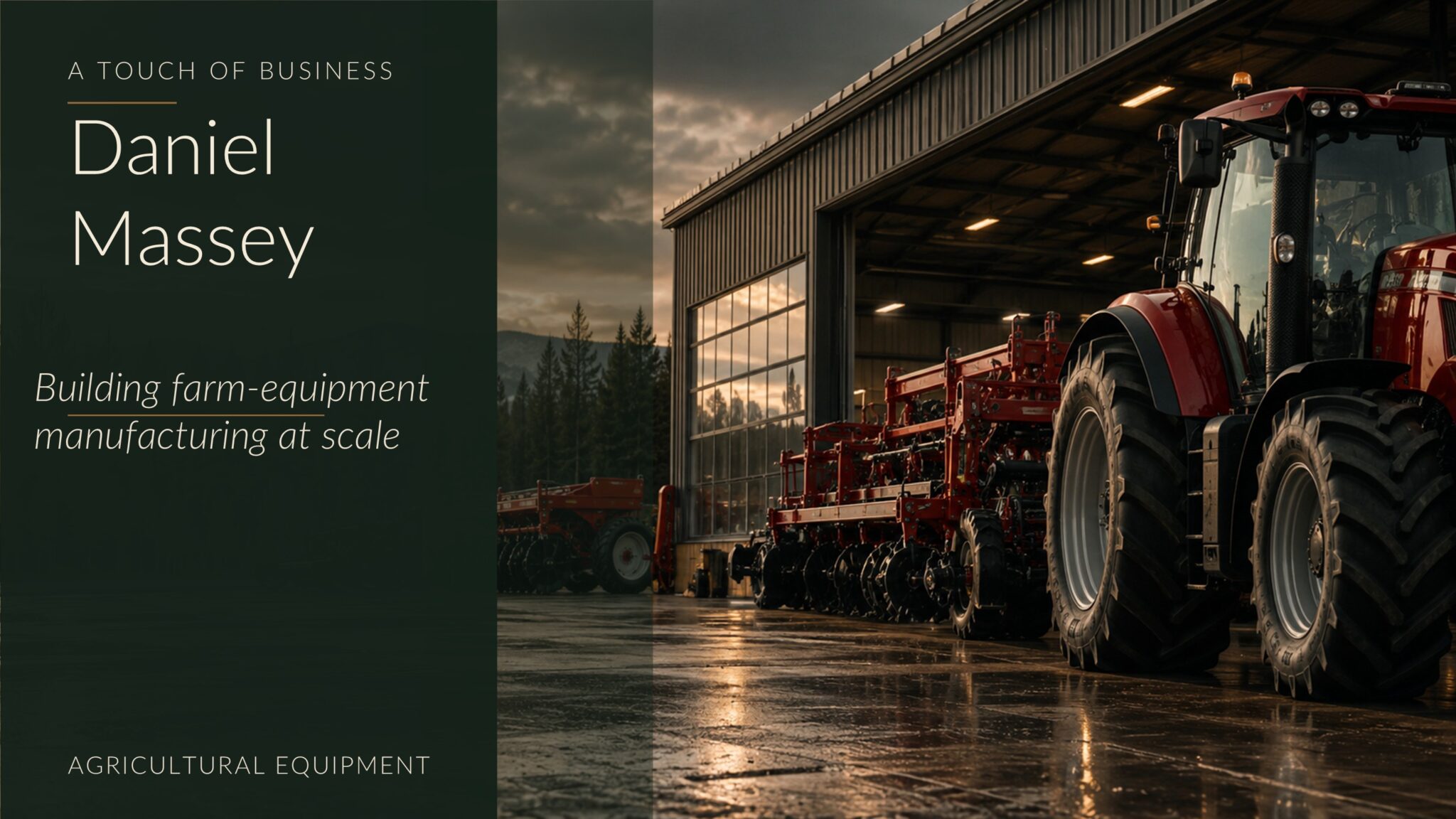 Rain-slick farm-equipment yard with red tractors, implements, and a lit industrial barn at dusk.