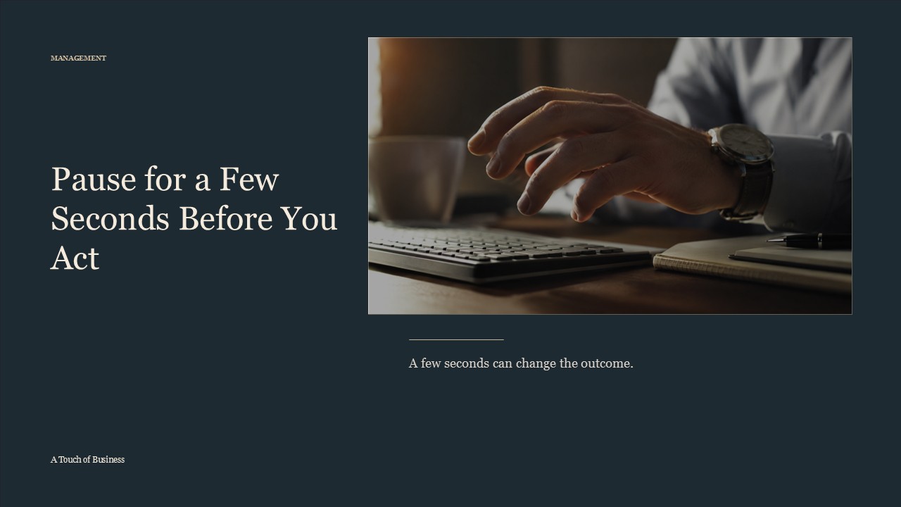 Realistic cinematic image of a hand pausing above a keyboard beside a notebook and pen for a management article.