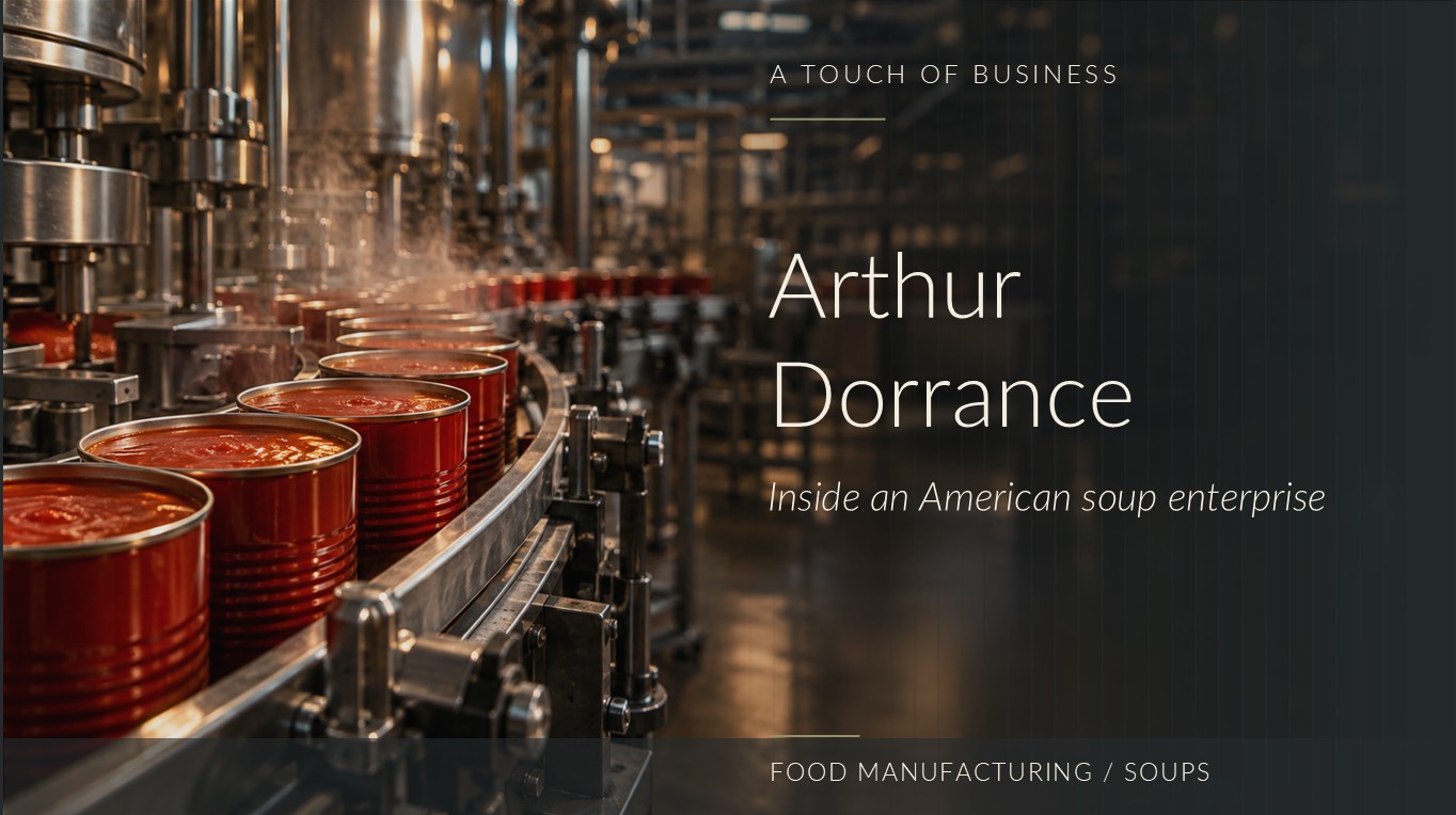 Open metal cans of tomato-red soup travel along a steam-filled industrial filling line.