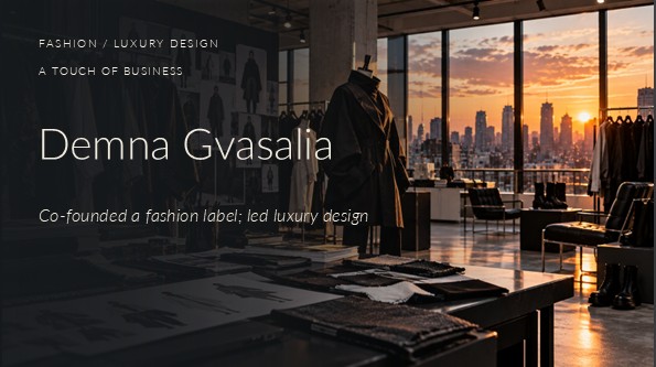 Cinematic photograph of an avant-garde fashion design studio at sunset, featuring a black sculptural coat on a mannequin, clothing racks, fashion sketches, fabric samples, and a city skyline.